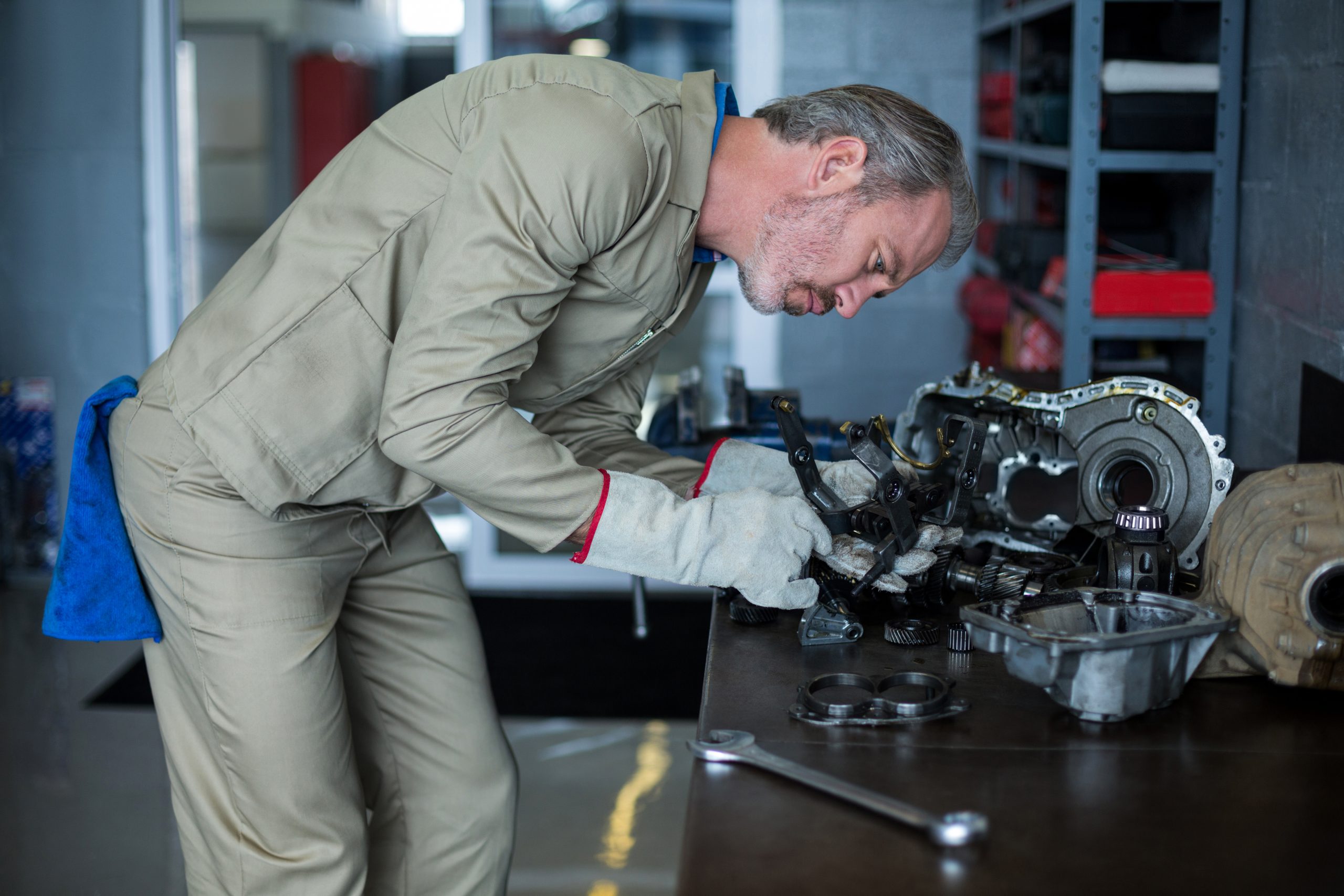 Mechanic inspecting engine components as part of engine installation service at TruFix Auto Repair in Nampa ID
