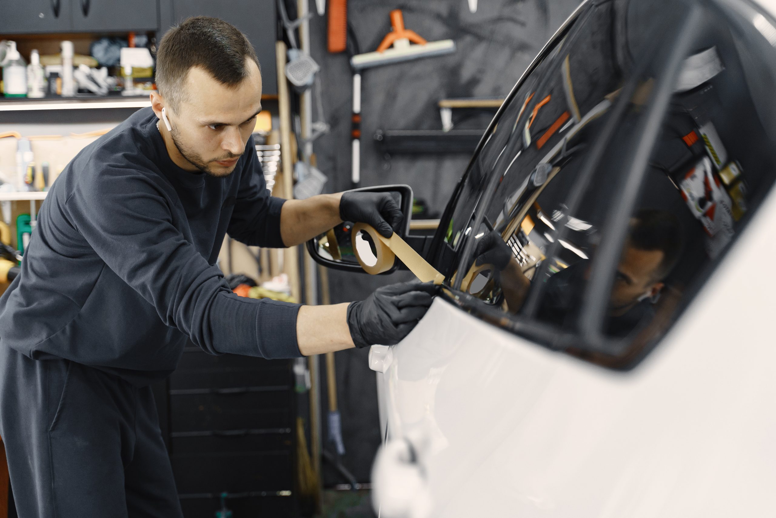 Auto technician preparing vehicle door for repair at Trufix Auto Repair in Nampa, ID